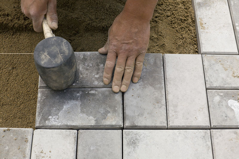 hammering down paving stones